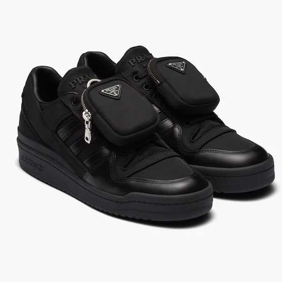 View of all black adidas forum low shoes.